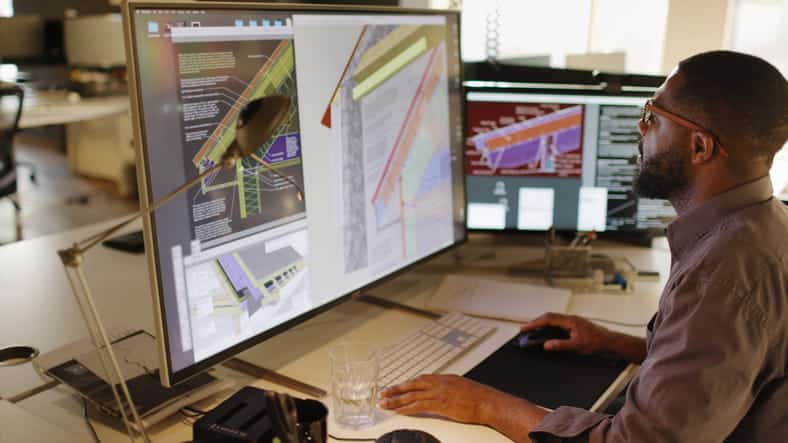 A CAD designer working on his computer. 